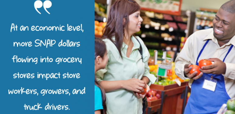 customer and produce worker at grocery store